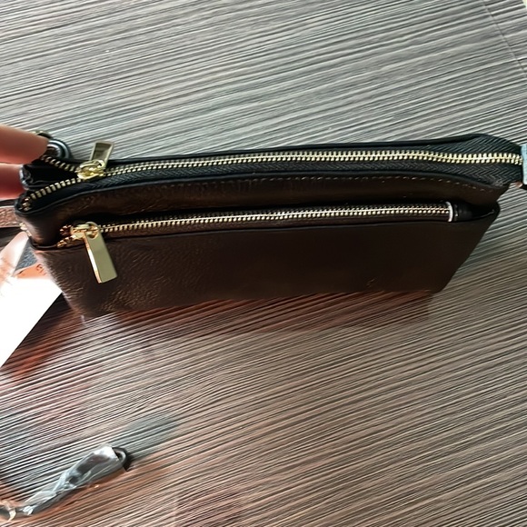 Small black leather crossbody with optional wristlet strap. - Picture 2 of 10